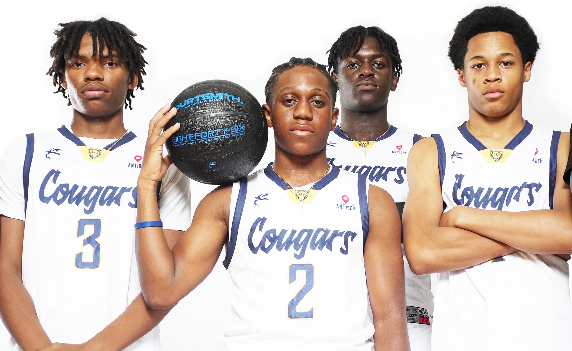 Cougars basketball players wearing white Courtsmith team uniforms, with a Courtsmith basketball